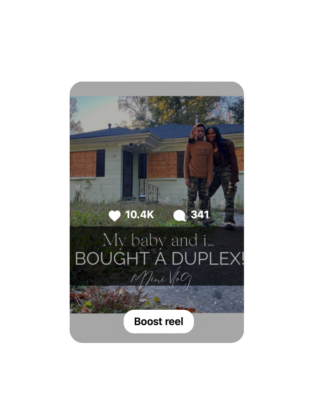 India and her son in front of the duplex they bought together