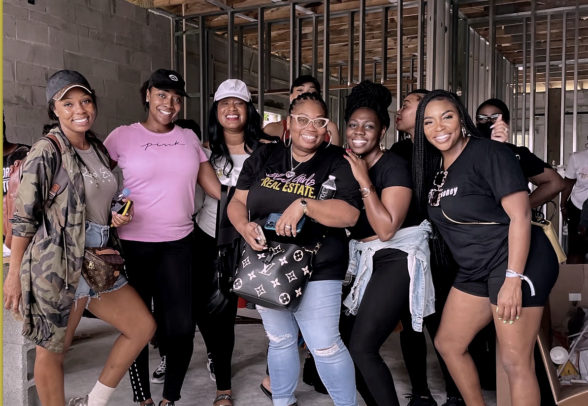 India and students on a new-construction site tour